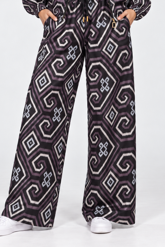 Mela Dotted Black/Brown pants by TAS, front view with jacket worn open