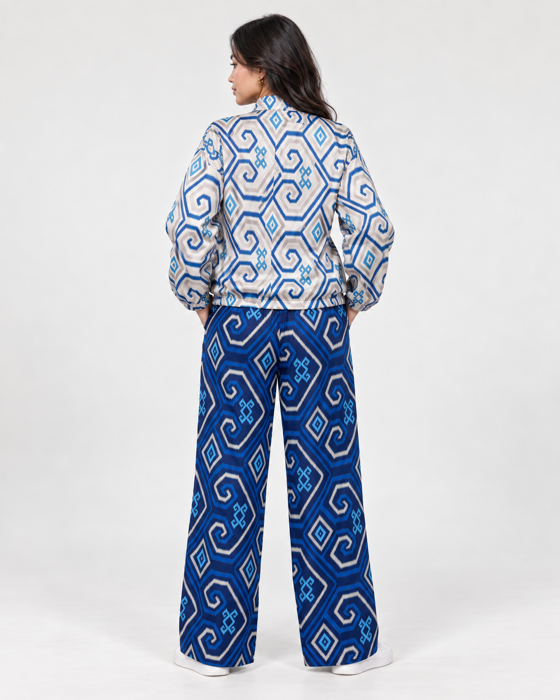 Back view of Mela Dotted Blue jacket and pants set by TAS